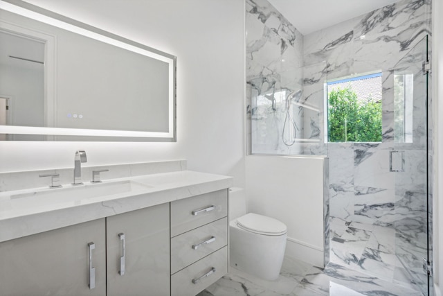 bathroom with vanity, an enclosed shower, and toilet