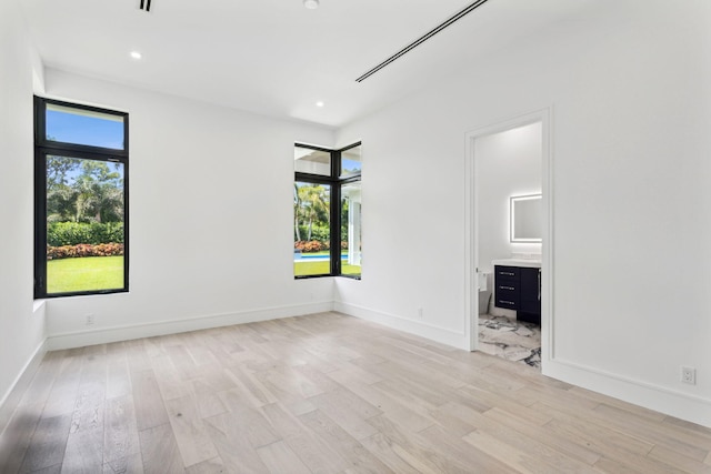 interior space featuring plenty of natural light and light hardwood / wood-style flooring