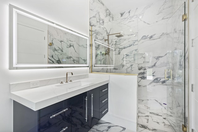 bathroom featuring vanity and a shower with door