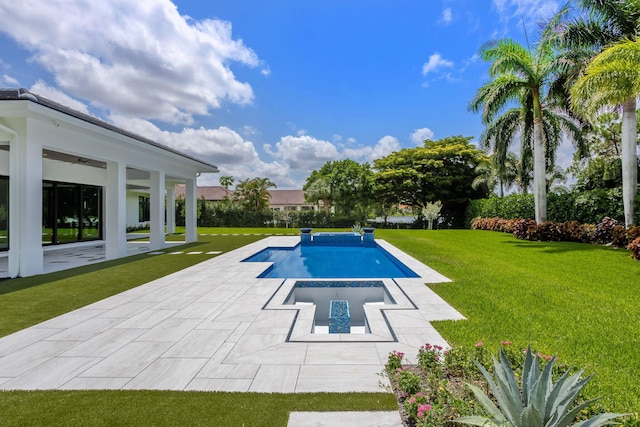 view of pool with a yard and a patio