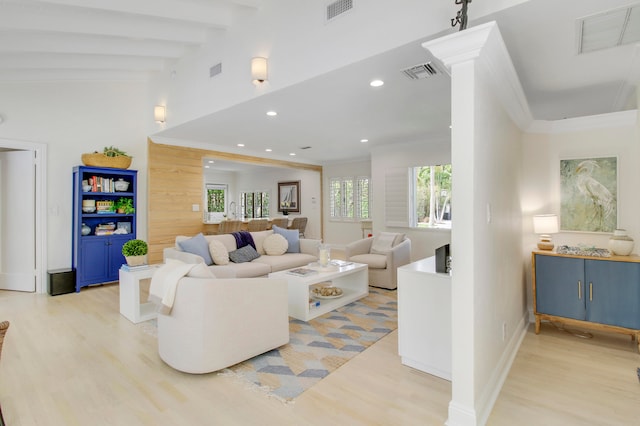 living room with lofted ceiling with beams and light wood-type flooring