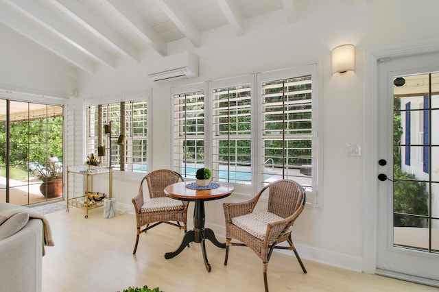 interior space with an AC wall unit, vaulted ceiling with beams, and a wealth of natural light