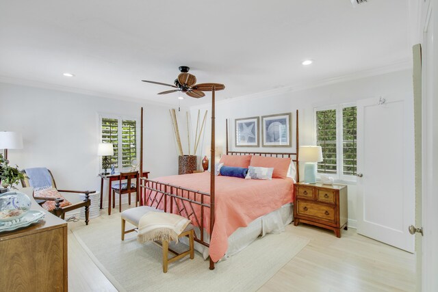 bedroom featuring crown molding, light wood-type flooring, and ceiling fan