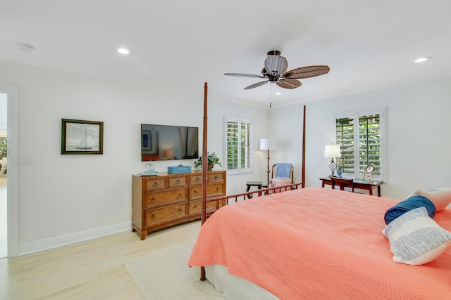 bedroom with ceiling fan, light hardwood / wood-style flooring, and crown molding