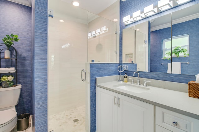 bathroom featuring crown molding, an enclosed shower, toilet, and vanity