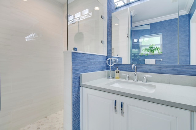 bathroom featuring ornamental molding, tile walls, and vanity