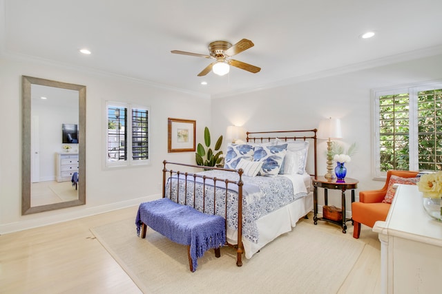 bedroom with ceiling fan, light hardwood / wood-style flooring, crown molding, and multiple windows