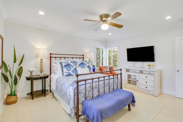 bedroom with light hardwood / wood-style floors, ornamental molding, and ceiling fan