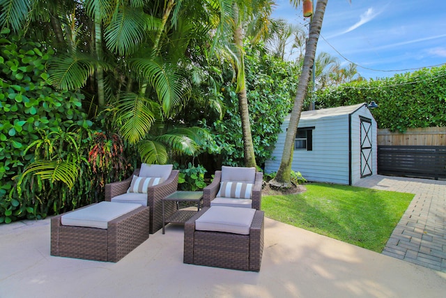 view of patio / terrace with a shed and an outdoor hangout area