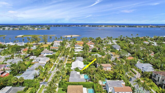 birds eye view of property featuring a water view