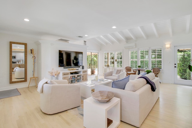 living room featuring lofted ceiling with beams, light hardwood / wood-style floors, and a wall mounted AC