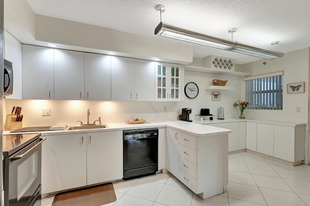 kitchen with pendant lighting, black appliances, white cabinets, sink, and kitchen peninsula