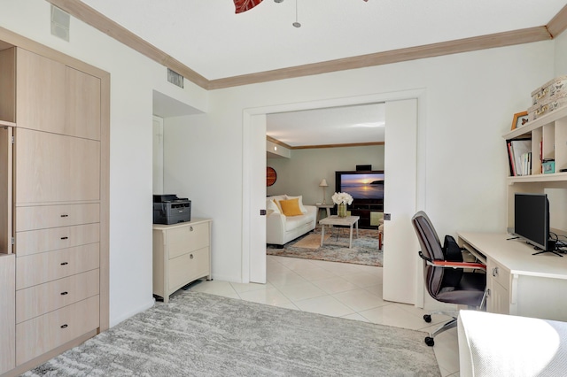 tiled office space featuring crown molding and ceiling fan