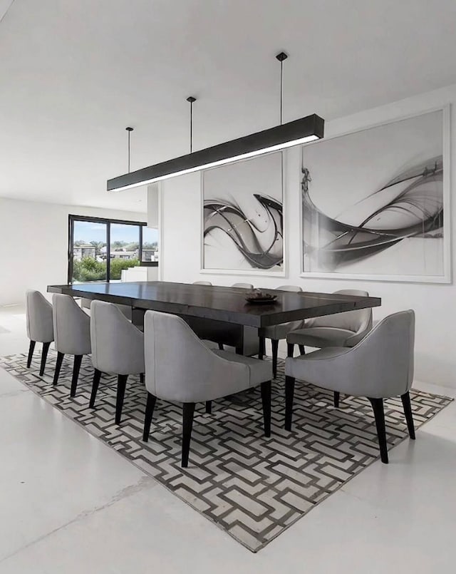 dining space with concrete flooring