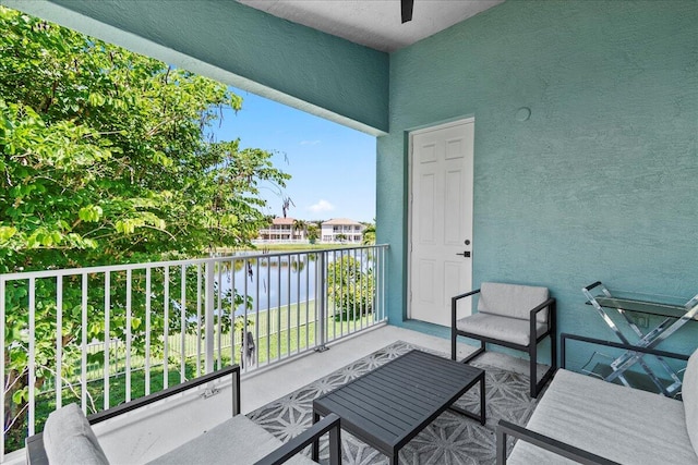 balcony featuring a water view