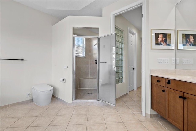 bathroom featuring vanity, walk in shower, toilet, and tile patterned floors