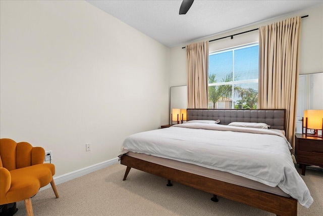 bedroom with carpet flooring, lofted ceiling, and ceiling fan