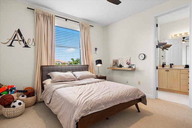 carpeted bedroom with ensuite bathroom