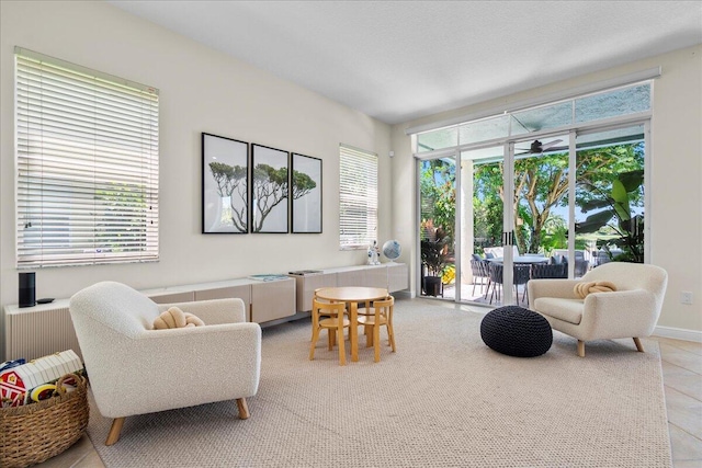 tiled living room with a healthy amount of sunlight