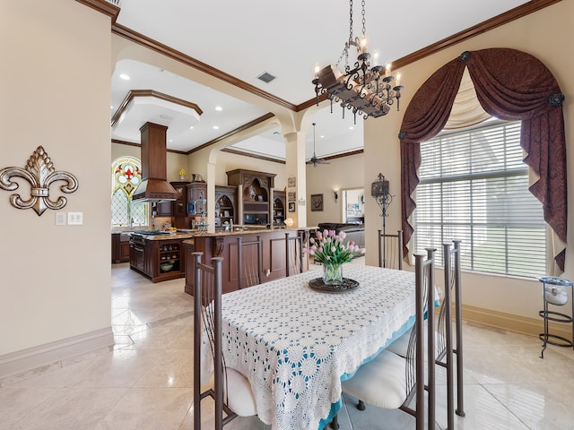 living room featuring ornamental molding, ceiling fan, light tile patterned floors, and a tray ceiling