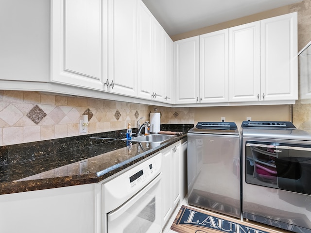 laundry room featuring sink and washing machine and dryer