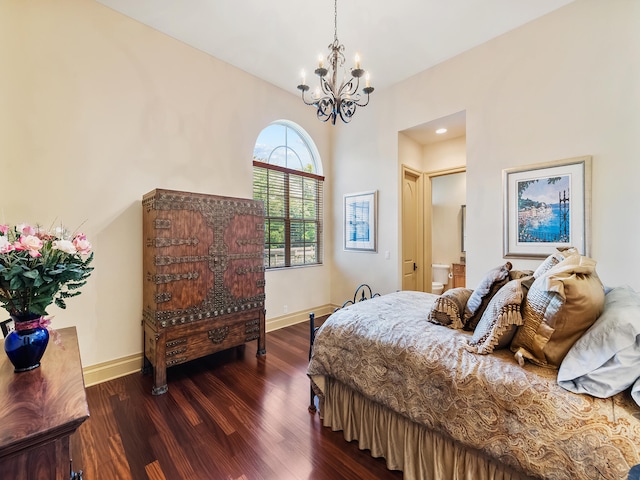 bedroom featuring a notable chandelier, ensuite bathroom, and tile patterned floors