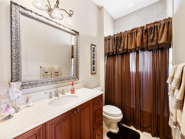 bathroom featuring vanity, tile patterned flooring, and tiled shower