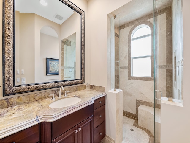 stairway featuring a high ceiling, sink, a notable chandelier, and light tile patterned floors