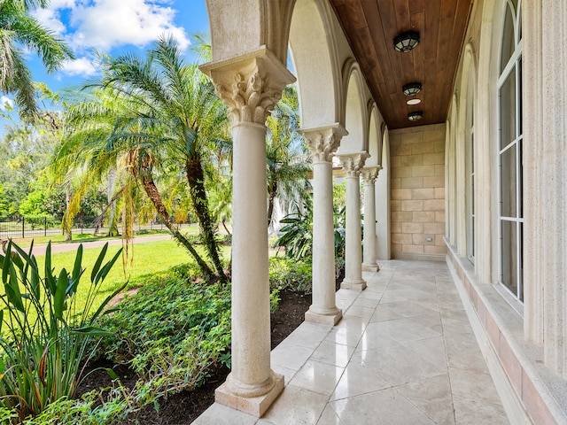 entrance foyer featuring french doors, tile patterned flooring, and a towering ceiling