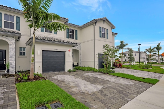 mediterranean / spanish-style home featuring a garage