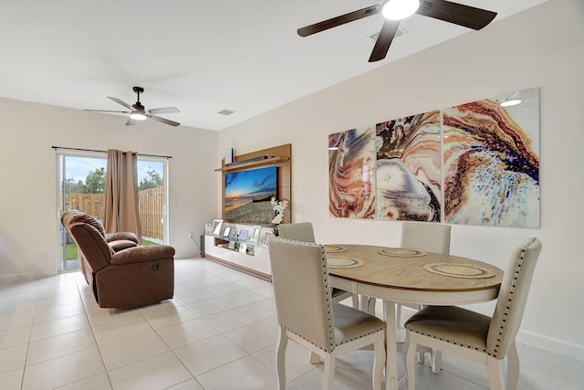 dining room with ceiling fan and light tile patterned flooring