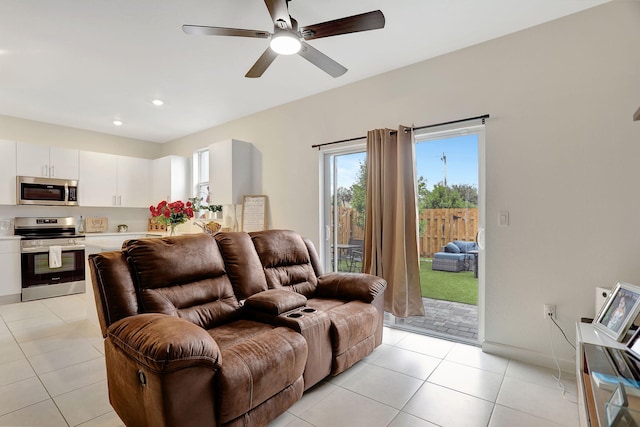 living room featuring ceiling fan and light tile patterned floors