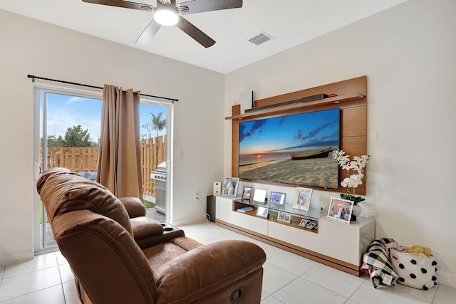 living room featuring light tile patterned flooring and ceiling fan