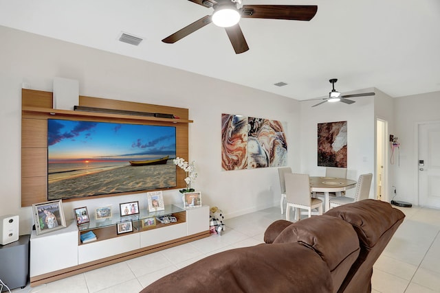 tiled living room featuring ceiling fan