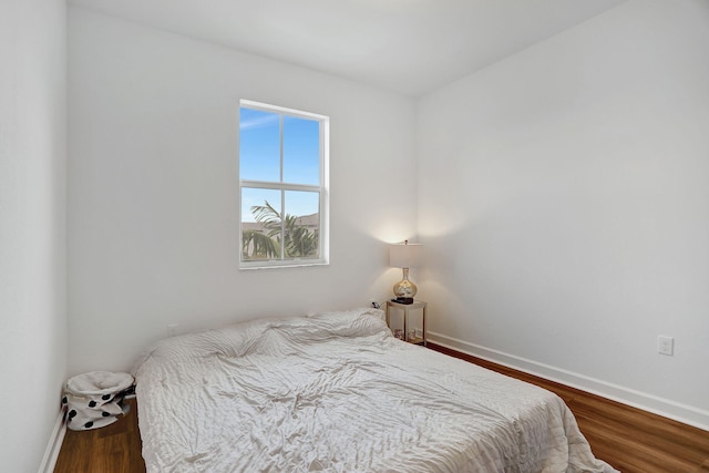 bedroom featuring dark hardwood / wood-style floors