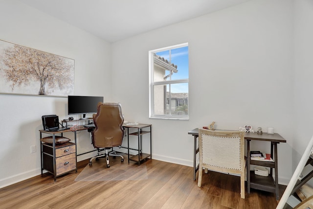 home office featuring hardwood / wood-style floors