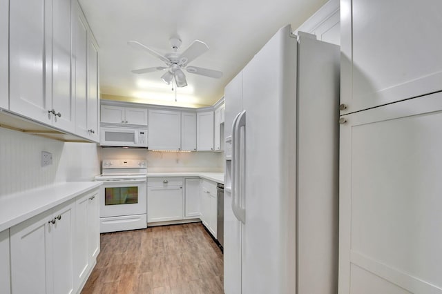 kitchen with ceiling fan, white cabinets, white appliances, and light wood-type flooring