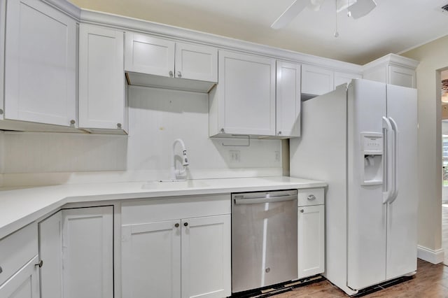 kitchen with white cabinetry, dishwasher, sink, white refrigerator with ice dispenser, and hardwood / wood-style flooring