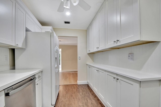 kitchen featuring stainless steel dishwasher, ceiling fan, light wood-type flooring, and white cabinetry