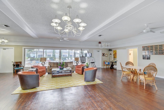 living room featuring beamed ceiling, a textured ceiling, ceiling fan with notable chandelier, and hardwood / wood-style flooring