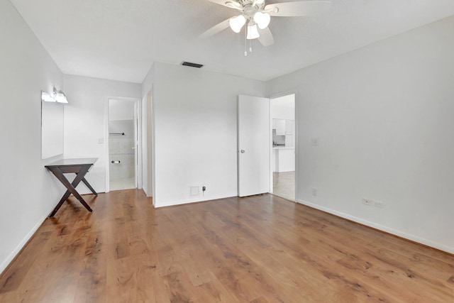 interior space with ceiling fan and hardwood / wood-style floors