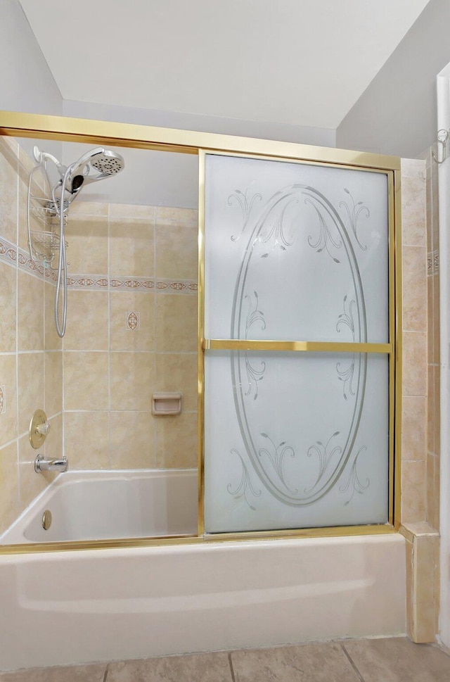 bathroom with tile patterned floors and enclosed tub / shower combo