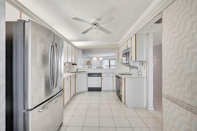 kitchen featuring stainless steel refrigerator, range with electric cooktop, white dishwasher, a textured ceiling, and light tile patterned floors