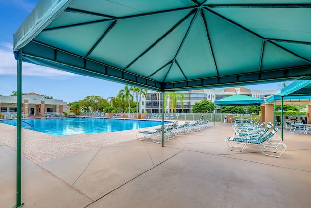 view of swimming pool with a gazebo and a patio