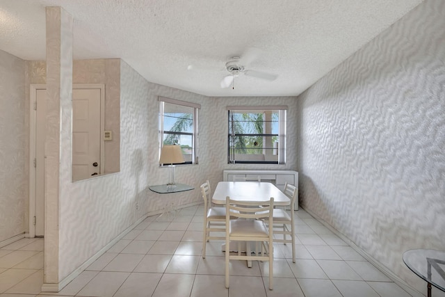 bathroom featuring tile patterned flooring, a textured ceiling, and ceiling fan