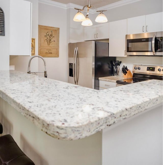 kitchen featuring kitchen peninsula, ornamental molding, stainless steel appliances, white cabinetry, and hanging light fixtures