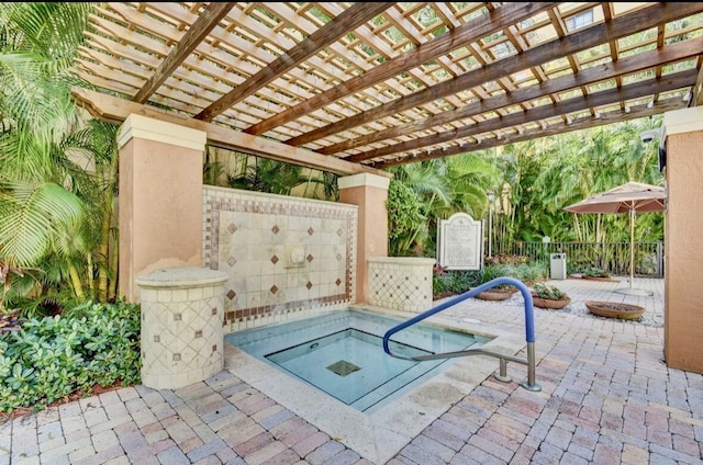 view of patio / terrace with a fire pit, a pergola, and an in ground hot tub