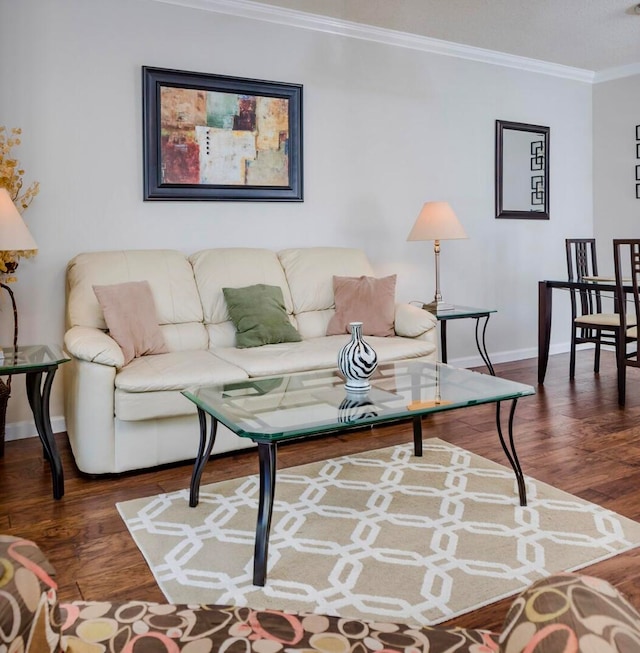 living room featuring dark hardwood / wood-style flooring and crown molding