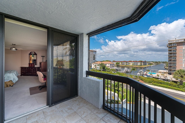 balcony featuring a water view