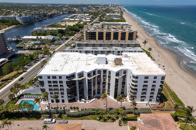 aerial view with a water view and a beach view